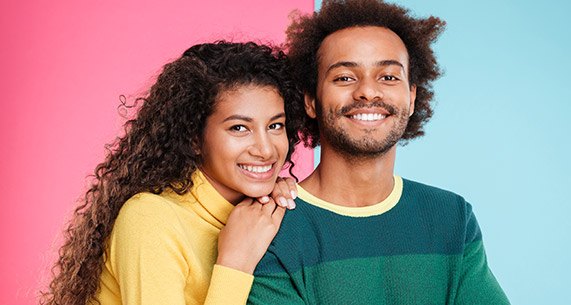 Young man and woman smiling