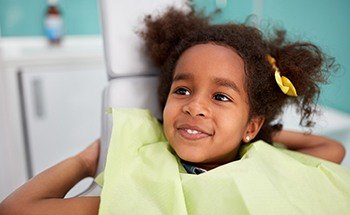 Smiling little girl in dental chair