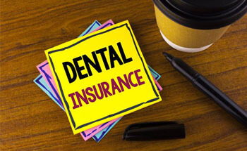 Dental insurance written on post it note