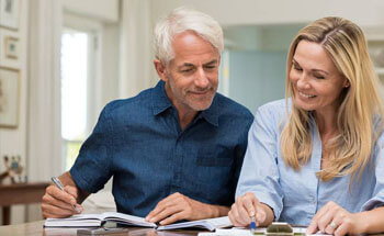 Older man and woman looking at paperwork