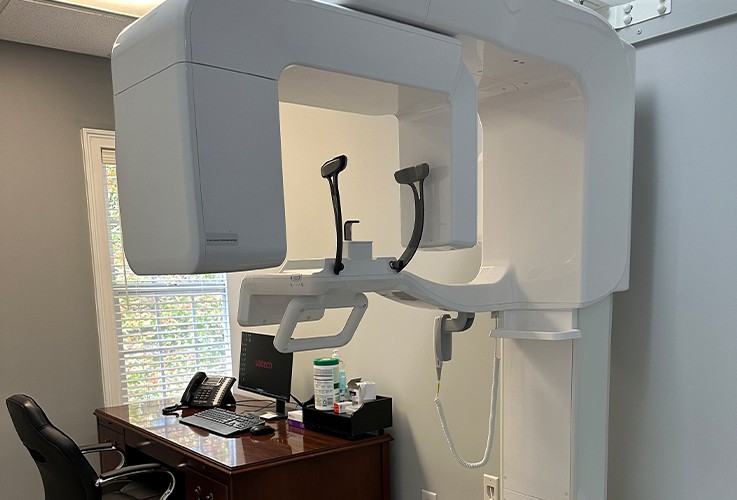 Dr. Patel and patient in dental exam room