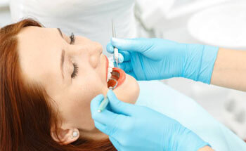 Woman receiving gum disease treatment