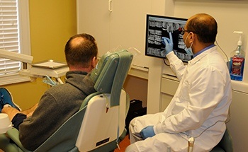 Dr. Patel and patient in dental exam room