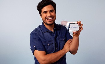 Man holding ProMonitoring app device in Woodstock