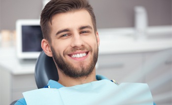 Smiling man in the dental chair
