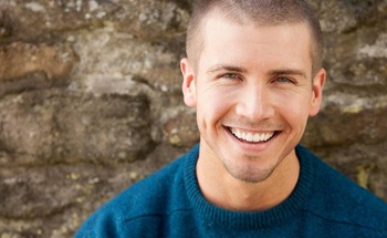 Man smiling after sedation dentistry in Woodstock