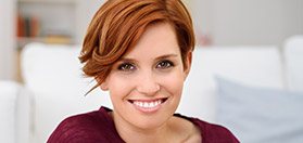 Woman with short red hair smiling
