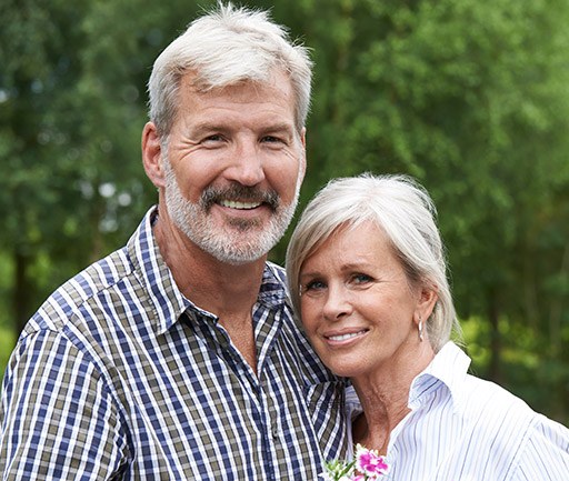 Smiling senior man and woman outdoors