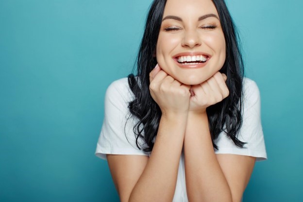 person with porcelain veneers smiling