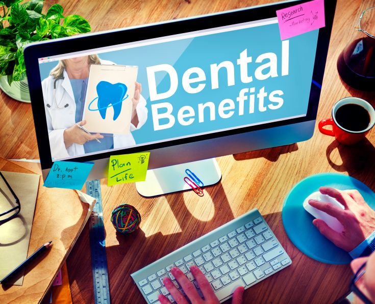 A computer monitor with the words dental benefits on it