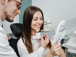 a patient selecting their veneers during a dental appointment