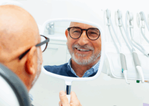 a patient with dental implants smiling